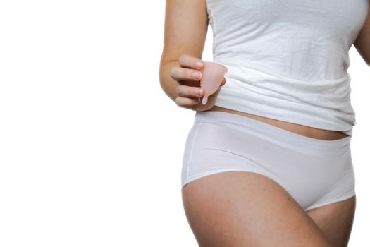 Young female holding menstrual isolated on white background, device into vagina with menstruation, Environmental,woman concept copy space