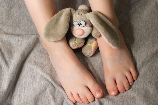 Syndactyly. Hereditary disease. Barefoot child. Feet of a small child with sidactyly disease close up.