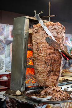 Traditional Turkish food Doner Kebab. Turnspit skewing kebap  kebab shawarma