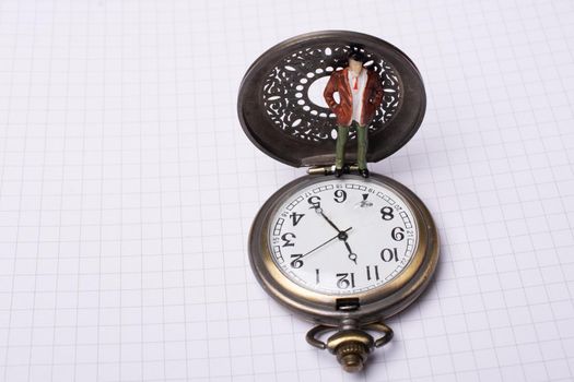 Mechanical retro pocket watch  and a man figurine