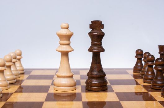 Intellectual game -chess. Wooden chess pieces on the chessboard