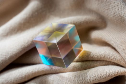 Luminous prism cubes refract light in different colors.
