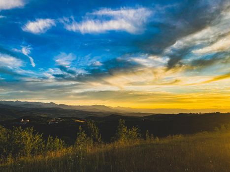 A beautiful view towards evening at sunset of the hills in Alta Langa, Piedmont - Italy