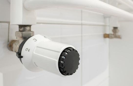 Bathroom Heating Radiator Temperature Adjusting Close Up. Savings Energy ny Smart Management. Residential HVAC Technologies.