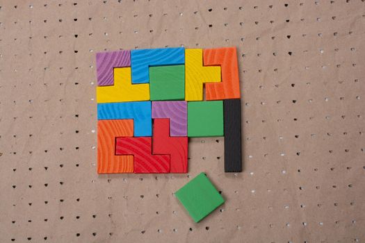 Concept of creative logical thinking. Different colorful wooden blocks. Geometric shapes in different colors.