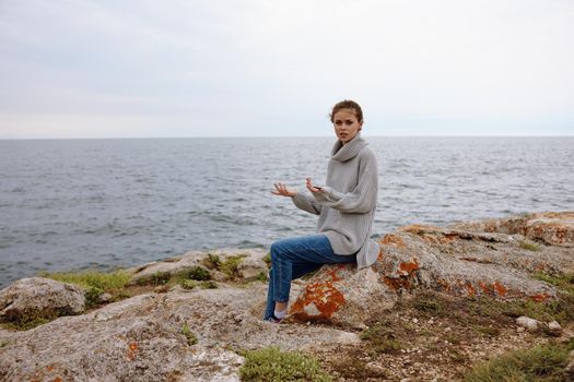 woman nature rocks coast landscape Ocean Lifestyle. High quality photo