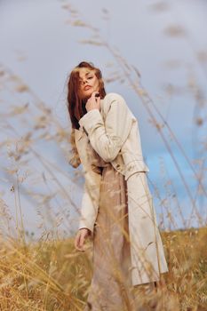 pretty woman walk in the field autumn season concept. High quality photo