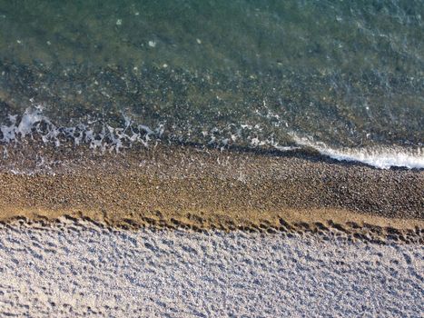 Aerial panoramic view of beautiful sunset above sea. Beautiful seascape. Sun glare, small waves on the water surface. Evening. Horizon. Nobody. No people. Copy space. Never-ending beauty of nature