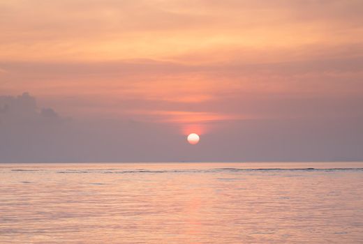 Beautiful  tropical  golden sea  sunset and yellow sky  background