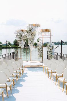 wedding ceremony area, arch chairs decor