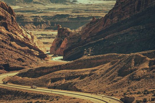 Scenic Utah Interstate 70 Highway. Sandstone Rock Formations Scenery and the Road Crossing the Raw Landscape.
