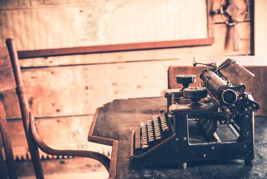 Vintage Room and Aged Wooden Desk with Typewriter. 