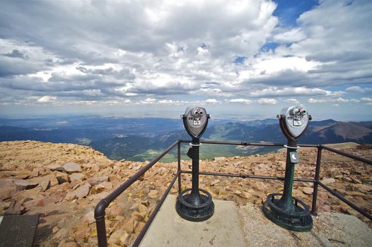 Pikes Peak Summit and Commercial Binoculars on the Concrete Deck. Pikes Peak Mountain, Colorado Springs, Colorado, USA.