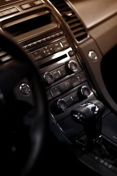 Car Dash. Modern Vehicle Dashboard - Central Console Vertical Photo. Multimedia Center, Climate Control and Automatic Transmission Stick Shift.