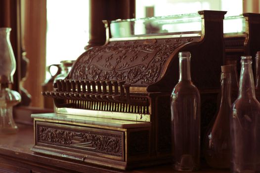 Vintage Cash Register in Old Western Store. Vintage Photo Collection.