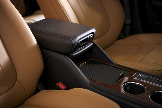 Car Leather Seats and Arm Rest. Modern Vehicle Interior Closeup.