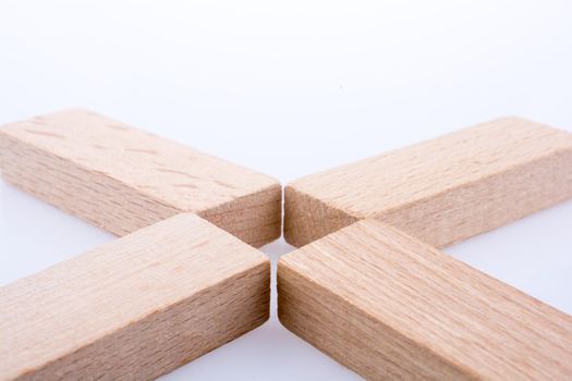 Wooden domino  pieces positioned on white background