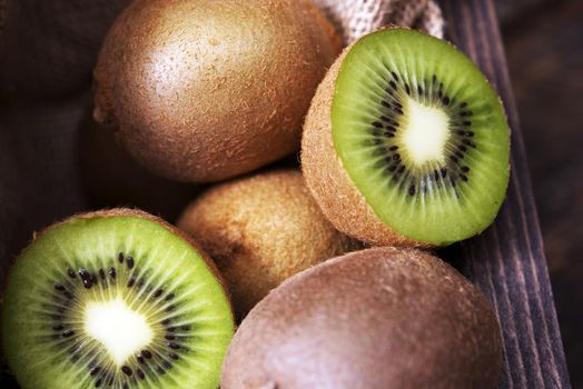 Fresh Sliced Kiwi Fruits on Wooden Table.