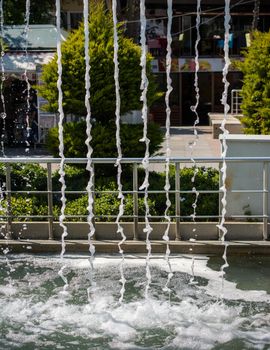 The fountains gushing sparkling water in a pool in a park