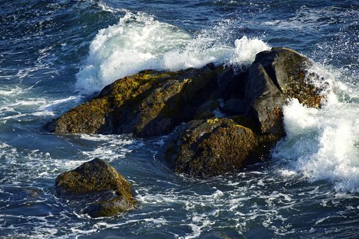 Rocky Ocean Shore in Crescent City, California, USA. Waves Crashing Into Large Rocks. Nature Photography Collection.