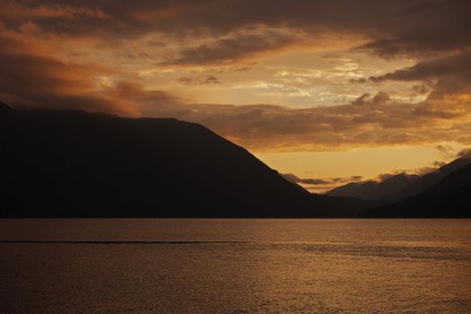 Sunset Sky Over the Lake. Lake Crescent, Washington, USA. Sunsets Photo Collection.