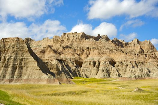 Badlands Prairie Landscape. Summer Cloudy Day in the Badlands NP, SD, USA. US National Parks Photo Collection 