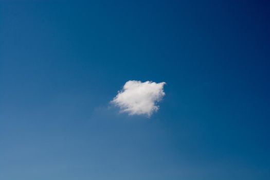 Blue cloudy sky with white  and grey clouds