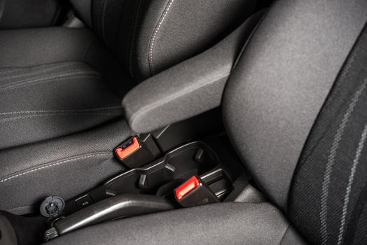 Economy Car Seats and Seating Belts Closeup Photo. Modern Transportation.