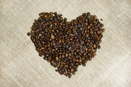 Coffee Beans Heart. Heart Shape Created From Fresh Coffee Beans - Linen Background. Drinks Photo Collection.