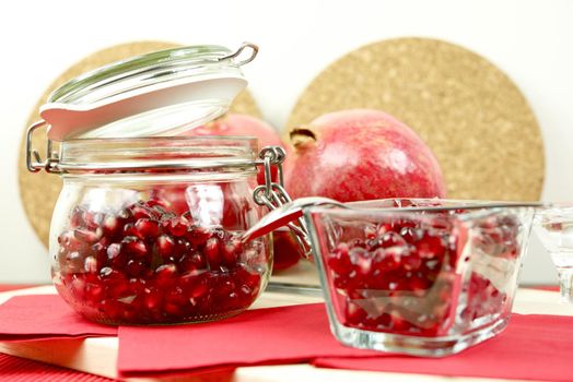 Pomegranate in Glass with Fresh Pomegranate in the Back. Fruits Photo Collection.