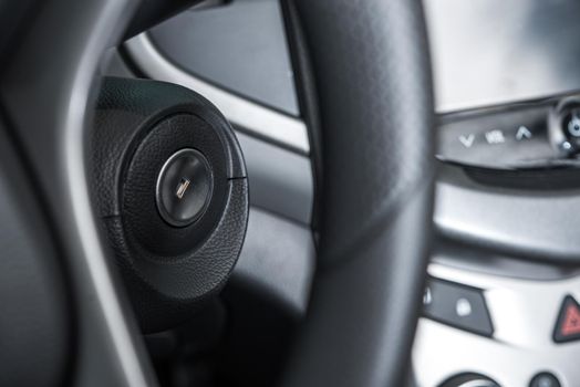 Modern Car Ignition Keyhole Closeup and Steering Wheel. 