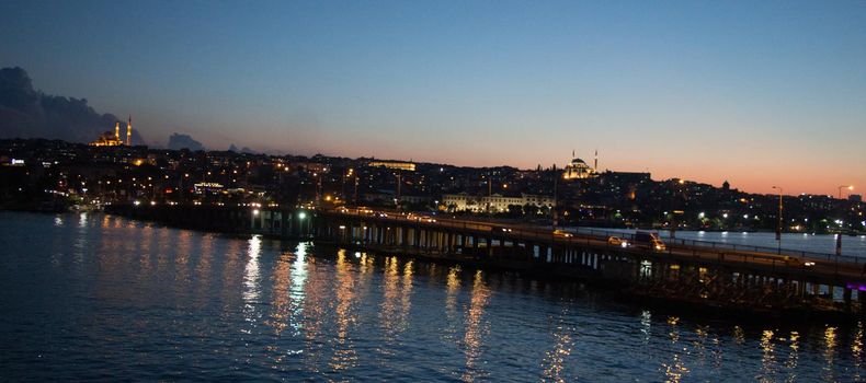 Ataturk bridge on Golden Horn at night on display