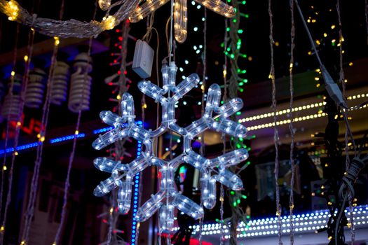 Christmas and party lights in the shape of a snowflake