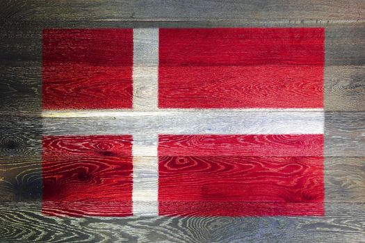 A Denmark flag on rustic old wood surface background