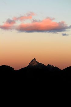 Spectacular sunset with colorful clouds and silhouette of mountains in Guadalest, Alicante, Spain