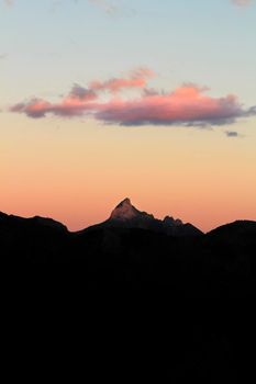 Spectacular sunset with colorful clouds and silhouette of mountains in Guadalest, Alicante, Spain