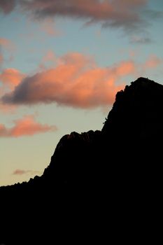 Spectacular sunset with colorful clouds and silhouette of mountains in Guadalest, Alicante, Spain