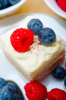 fresh homemade raspberry and blueberry cream cake 