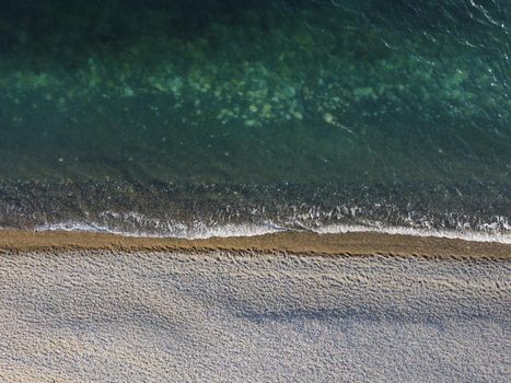 Aerial panoramic view of beautiful sunset above sea. Beautiful seascape. Sun glare, small waves on the water surface. Evening. Horizon. Nobody. No people. Copy space. Never-ending beauty of nature