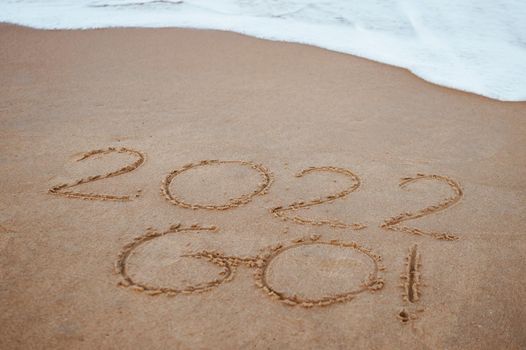 Start and go 2022 on the sand at the beach to show life ahead next year copyspace background