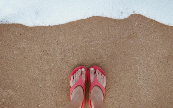 Summer vacation concept barefoot on sand at beach with copyspace background