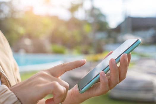 Woman hand using smartphone to do work business, social network, communication concept.