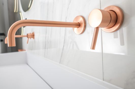 White Porcelain Sink With Copper Faucet, Knob, And Soap Dispenser.