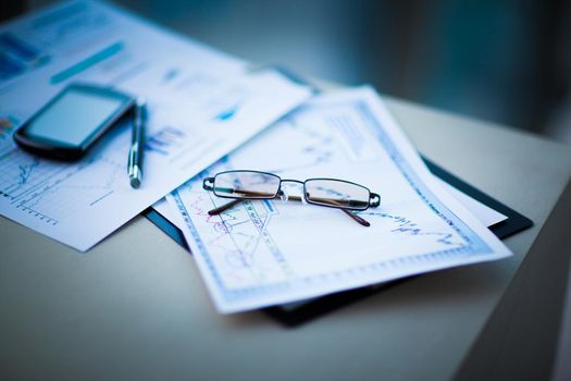 financial charts and graphs on the table