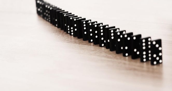 concept of reliability of a business team. dominoes leaning on each other. in the photo there is an empty space for your text