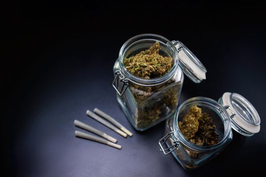 Dry marijuana in a jar and jamb