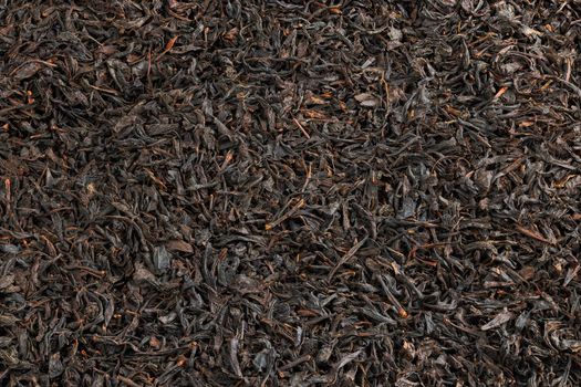 texture and full frame background of flat heap of dry long-term black tea.