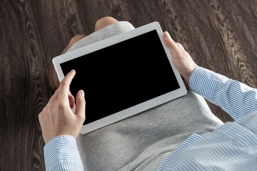 close-up of female hands with a computer tablet