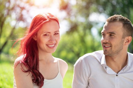 Portrait of a young attractive woman on a date in a park. Spending time with loved ones