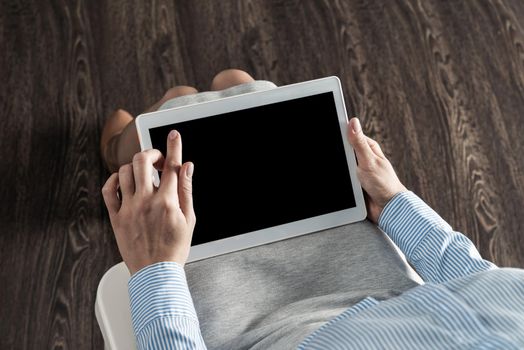 close-up of female hands with a computer tablet